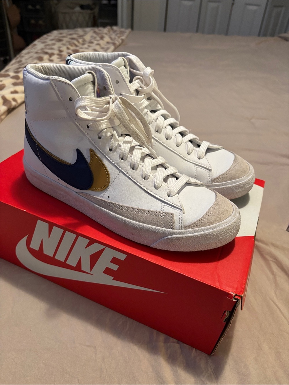 Nike White High-Top Sneakers with Blue and Gold Swoosh